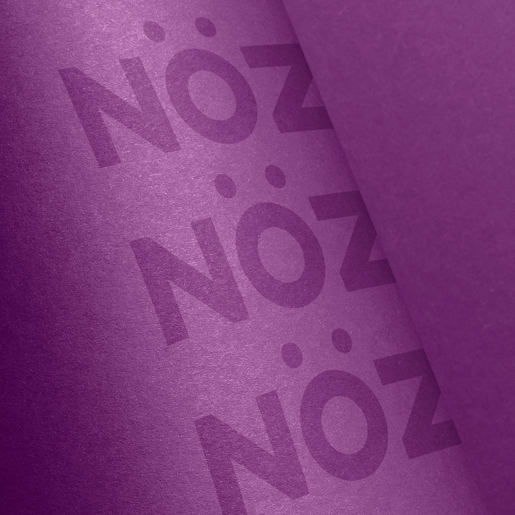 zoom on purple sunscreen with Nöz logo