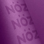 Load image into Gallery viewer, zoom on purple sunscreen with Nöz logo
